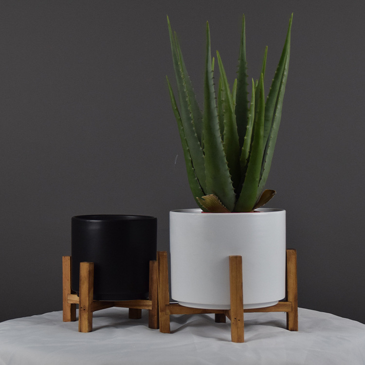 Black and white matte ceramic planter pots with wooden stand